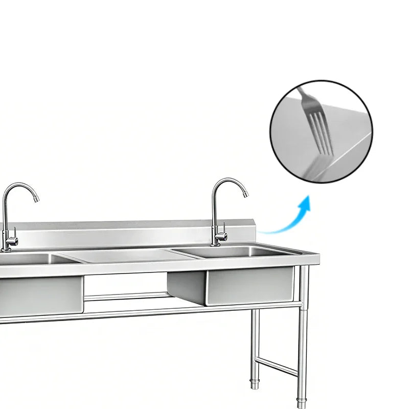 Stainless steel commercial kitchen sink with dual faucets and durable surface detail