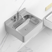 Wall-mounted touchless hand sink installed in a wash area