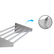 Tubular wall shelf with open pipe storage surface