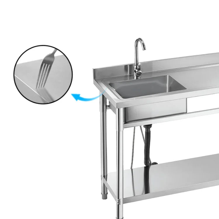 Stainless steel commercial sink with faucet and lower shelf, ideal for industrial kitchens