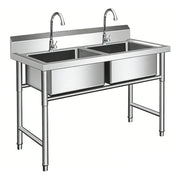 Stainless steel commercial sink with dual basins and faucets for industrial kitchens