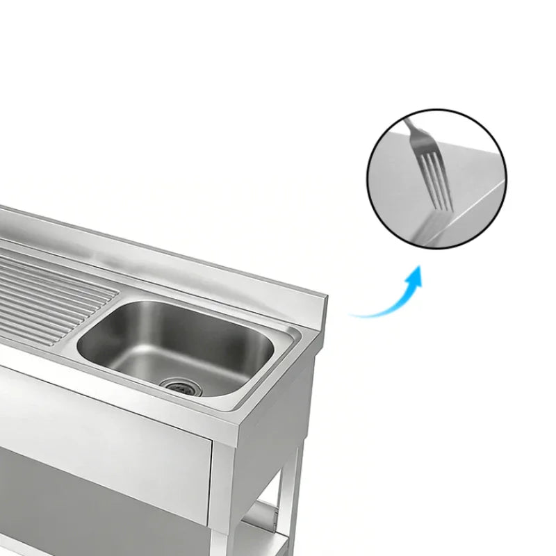 Stainless steel commercial sink with drainboard, showcasing durable surface with fork detail