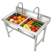 Stainless steel commercial sink with fruits and veggies, ideal for industrial kitchens